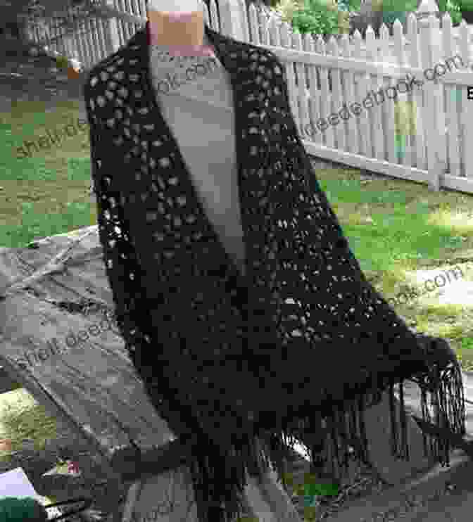 A Black Crochet Shawl With A Fringe Border. Crochet Shawls Patterns: Detail Guideline With Instruction And Image To Crochet Shawls Projects