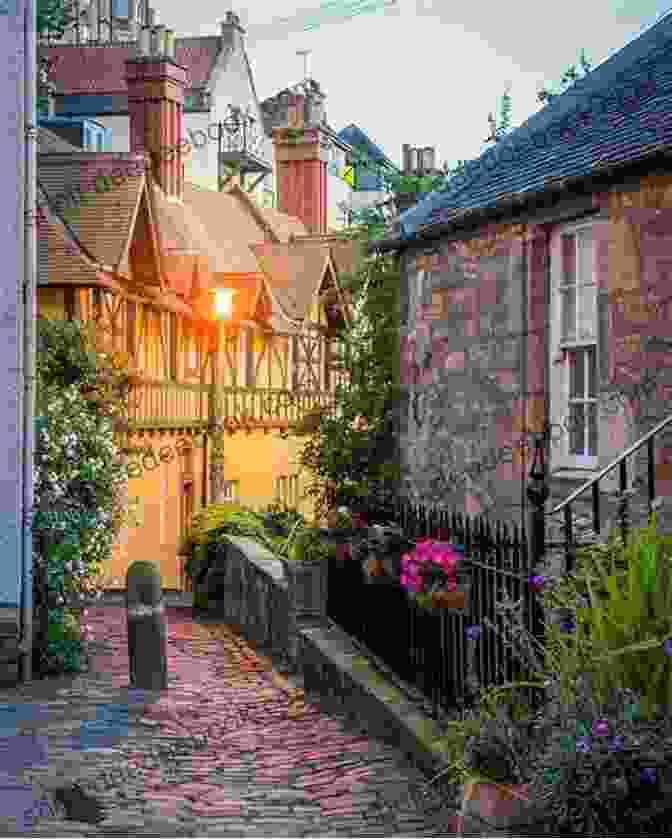 A Picturesque Photograph Of Dean Village, Showcasing Its Quaint Cottages, Lush Greenery, And The Picturesque Water Of Leith Flowing Through It. Edinburgh Directions Anna Nicholas