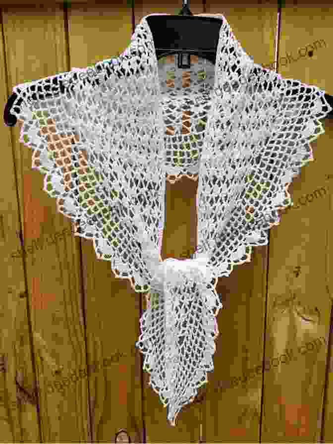 A White Crochet Shawl With A Delicate Lace Pattern. Crochet Shawls Patterns: Detail Guideline With Instruction And Image To Crochet Shawls Projects